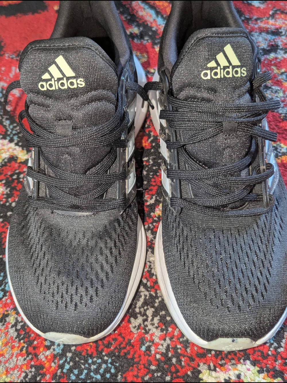 adidas Black Athletic Running Shoes with White Stripes and Subtle Yellow Accent